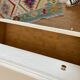 Restored wooden art deco chest of drawers with gilded handles