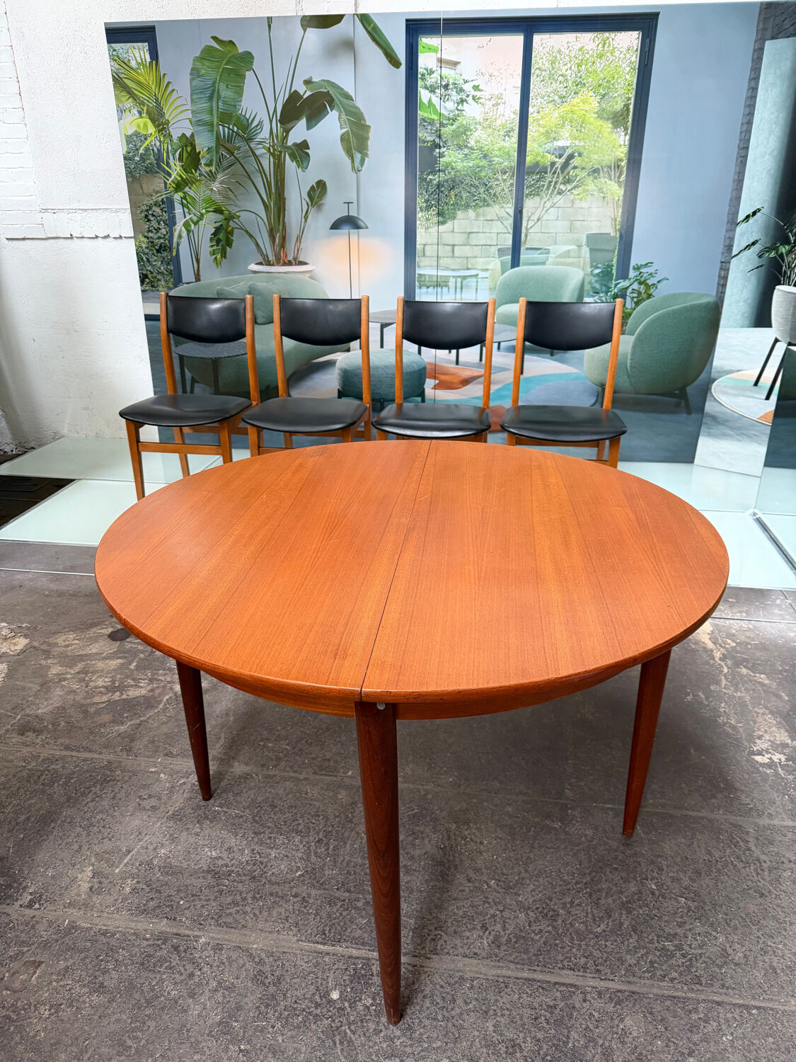 4 Scandinavian chairs in teak and black faux leather.