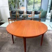 4 Scandinavian chairs in teak and black faux leather.