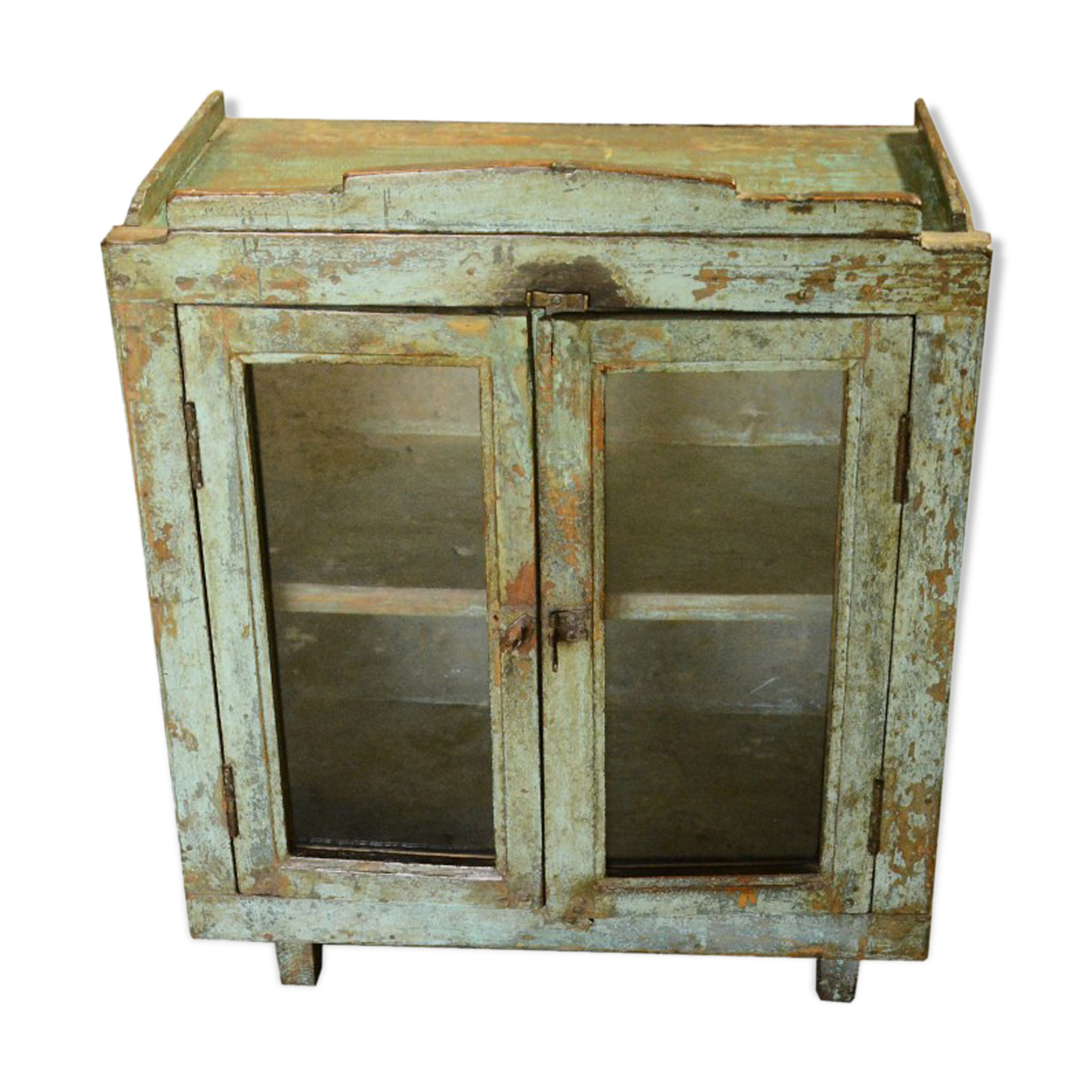 Green showcase on feet old teak wood