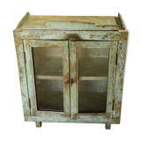 Green showcase on feet old teak wood