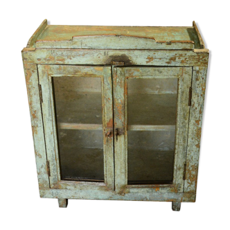 Green showcase on feet old teak wood