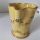 JP Daniel handmade earthenware pitcher – floral decoration on a yellow background