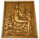 Carved oak panel depicting an allegorical female figure.