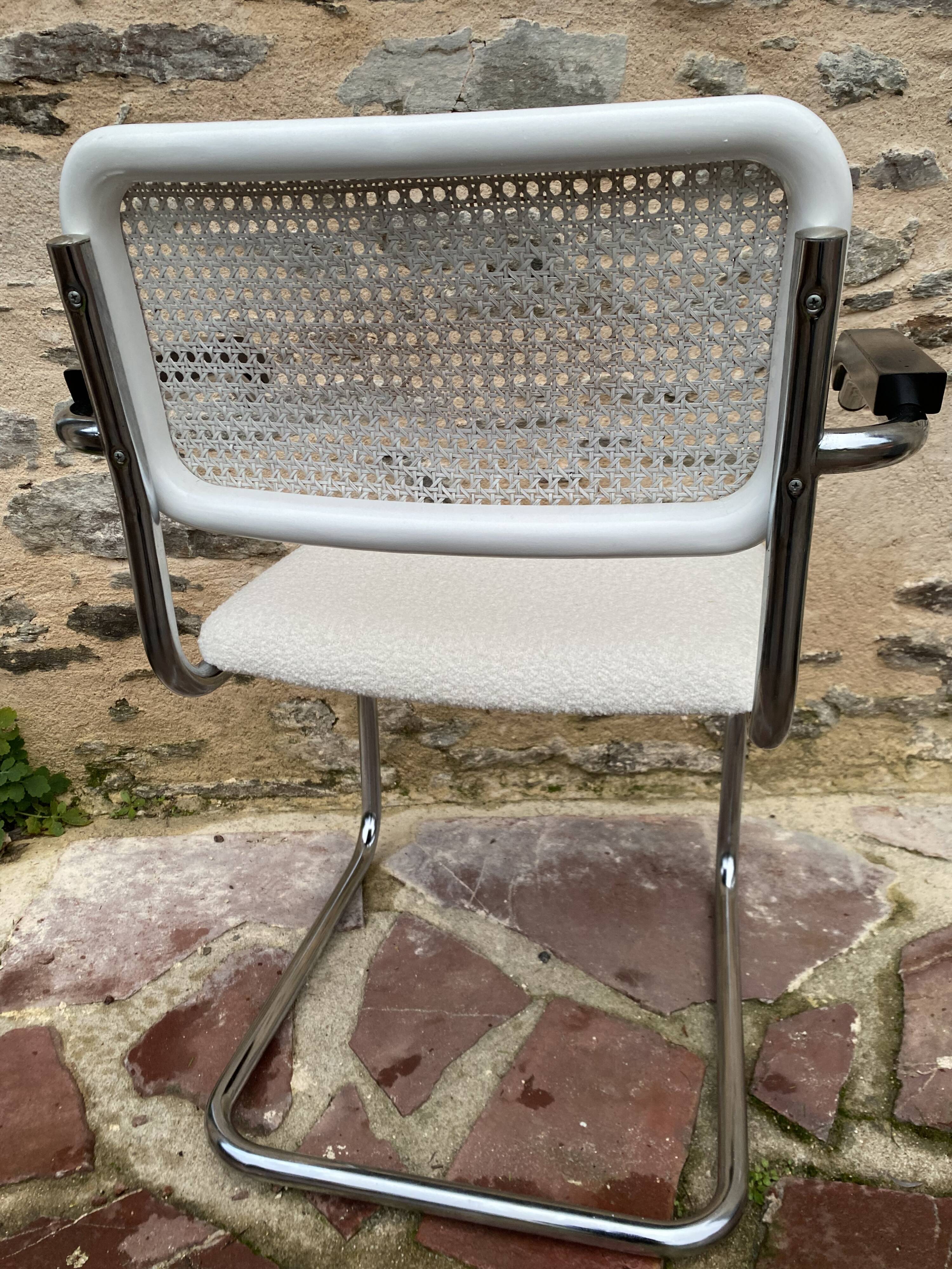 Cantilever armchair in cane and bouclette fabric