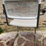 Cantilever armchair in cane and bouclette fabric