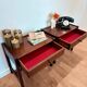 Pair of walnut bedside tables designed by Jacques Hauville for Roche Bobois.