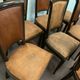Suite of 8 seated tinted wooden chairs and tawny leather backrest 1970s