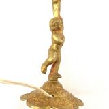 Lampe à poser cherubin en laiton.