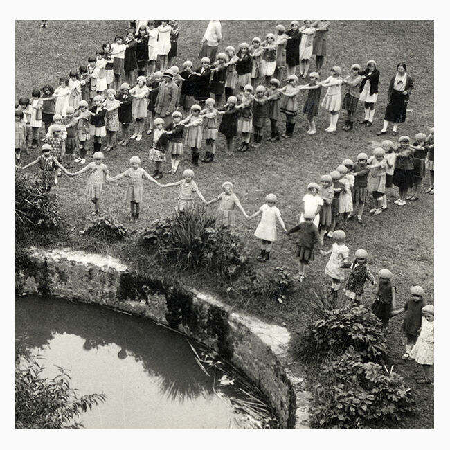 Ancient photograph of a choreography of children drawing a star