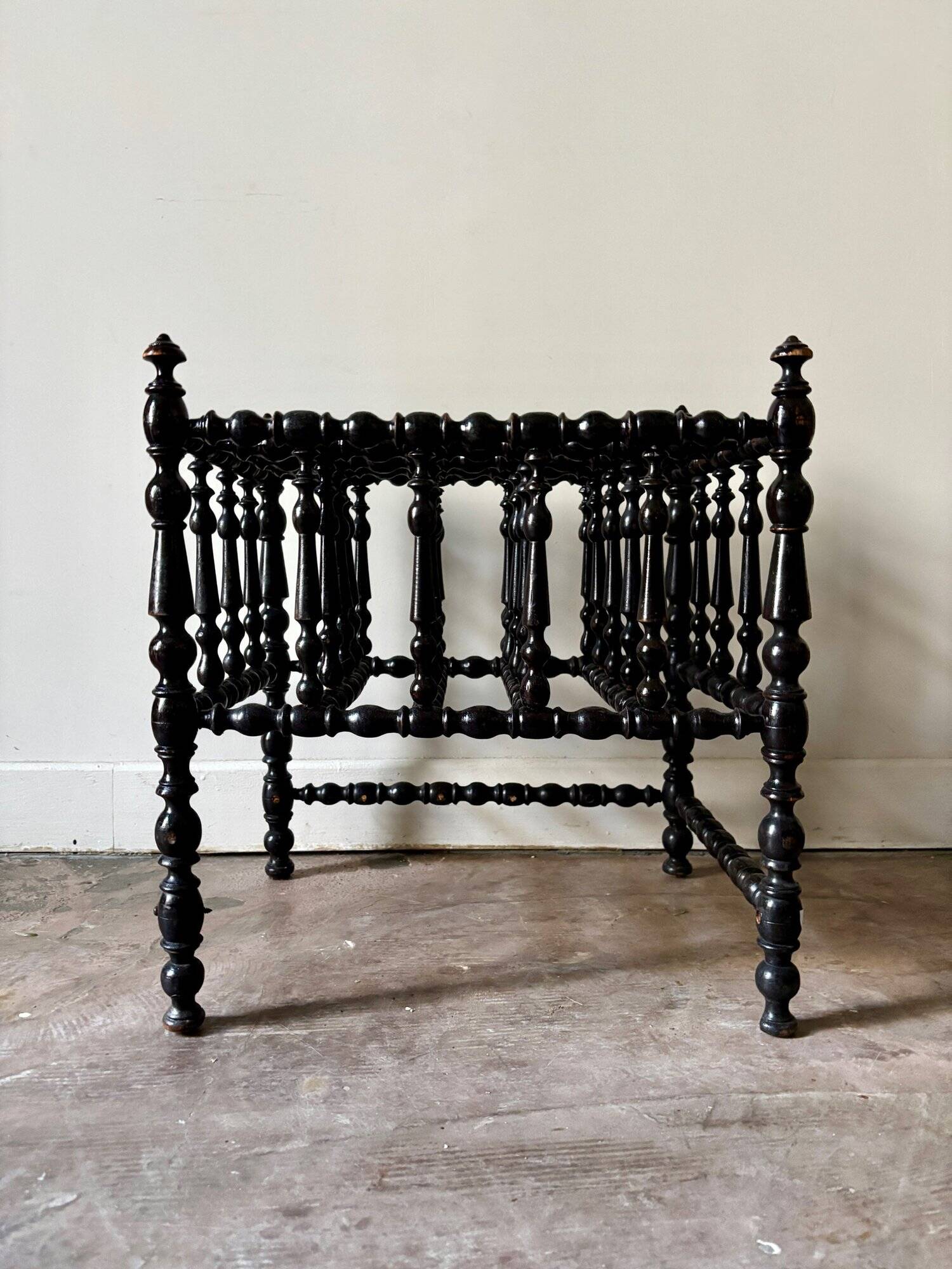 Napoleon III magazine rack in black turned wood