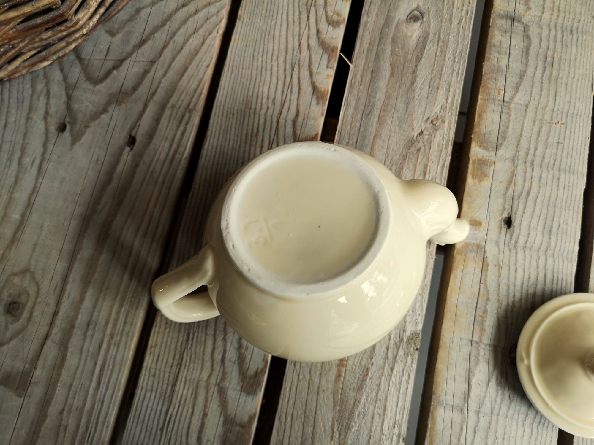 Little ancient teapot in ceramics color cream