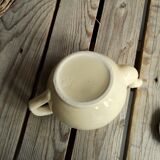 Little ancient teapot in ceramics color cream
