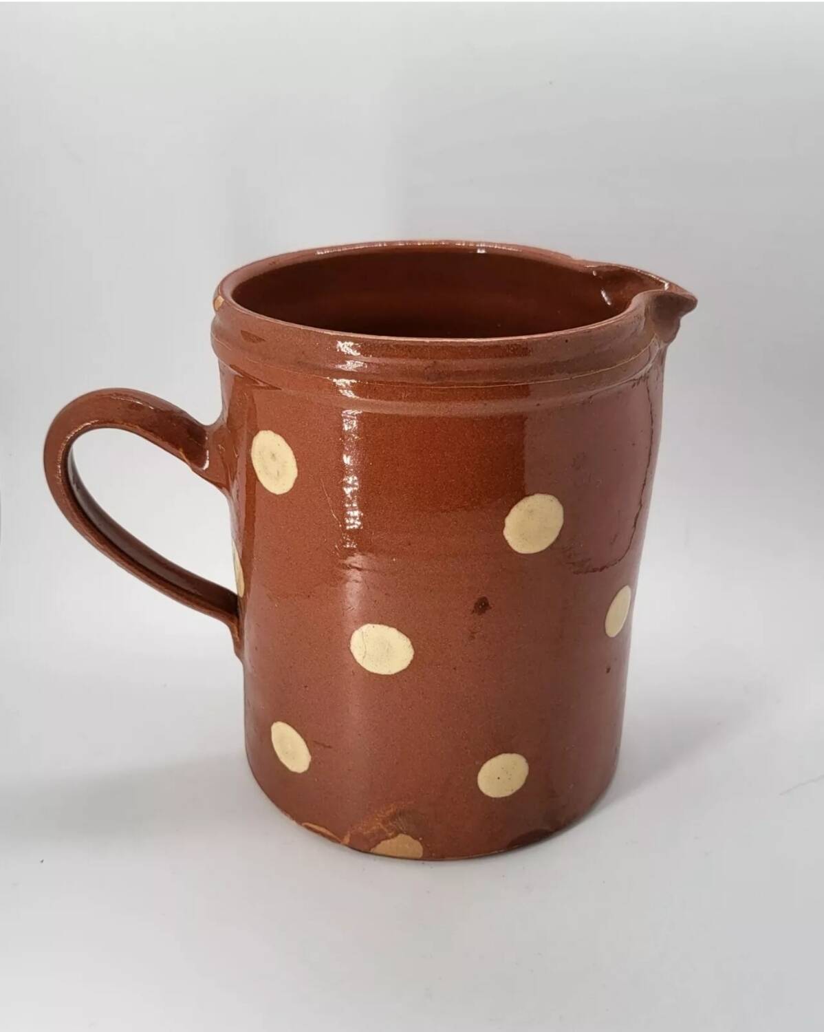 Old pitcher with polka dots savoyard pottery in glazed terracotta alsace