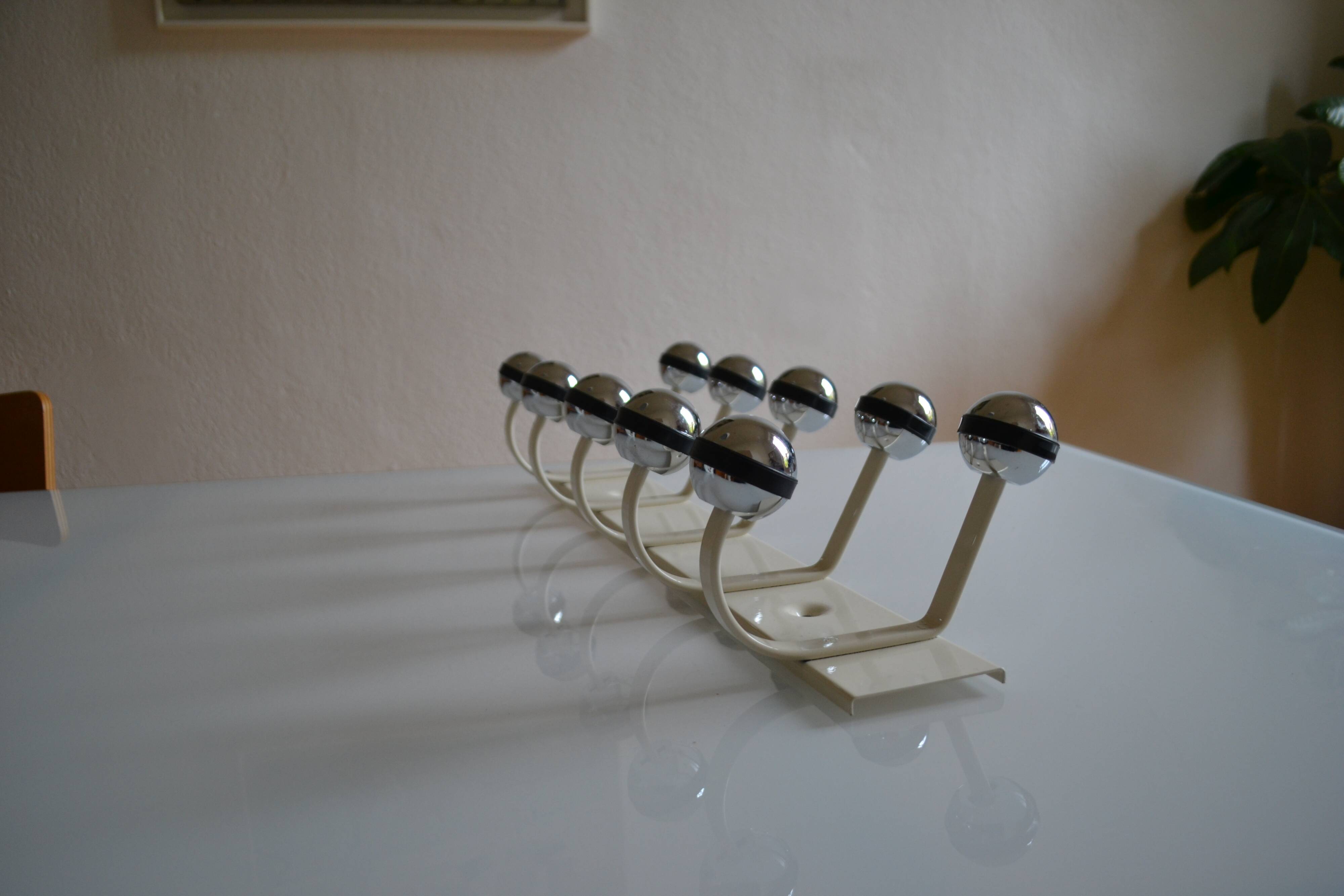 Vintage 1970s wall-mounted coat rack with 10 hooks