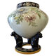 Large polychrome ceramic cache-pot with floral decoration.