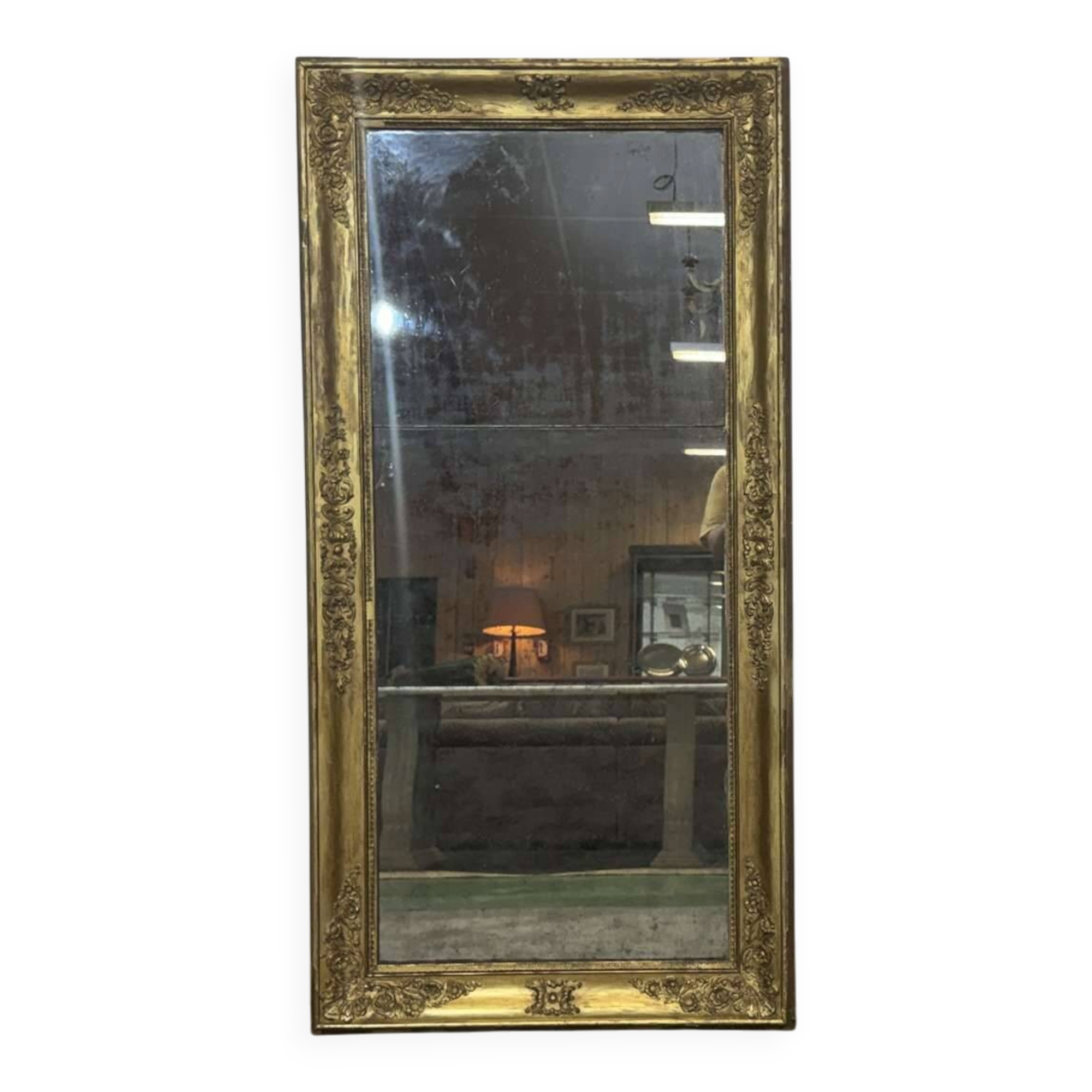 19th-century mirror in gilded wood and plaster.