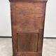 Art Nouveau cabinet with a shelf featuring distinctive floral sculptures.