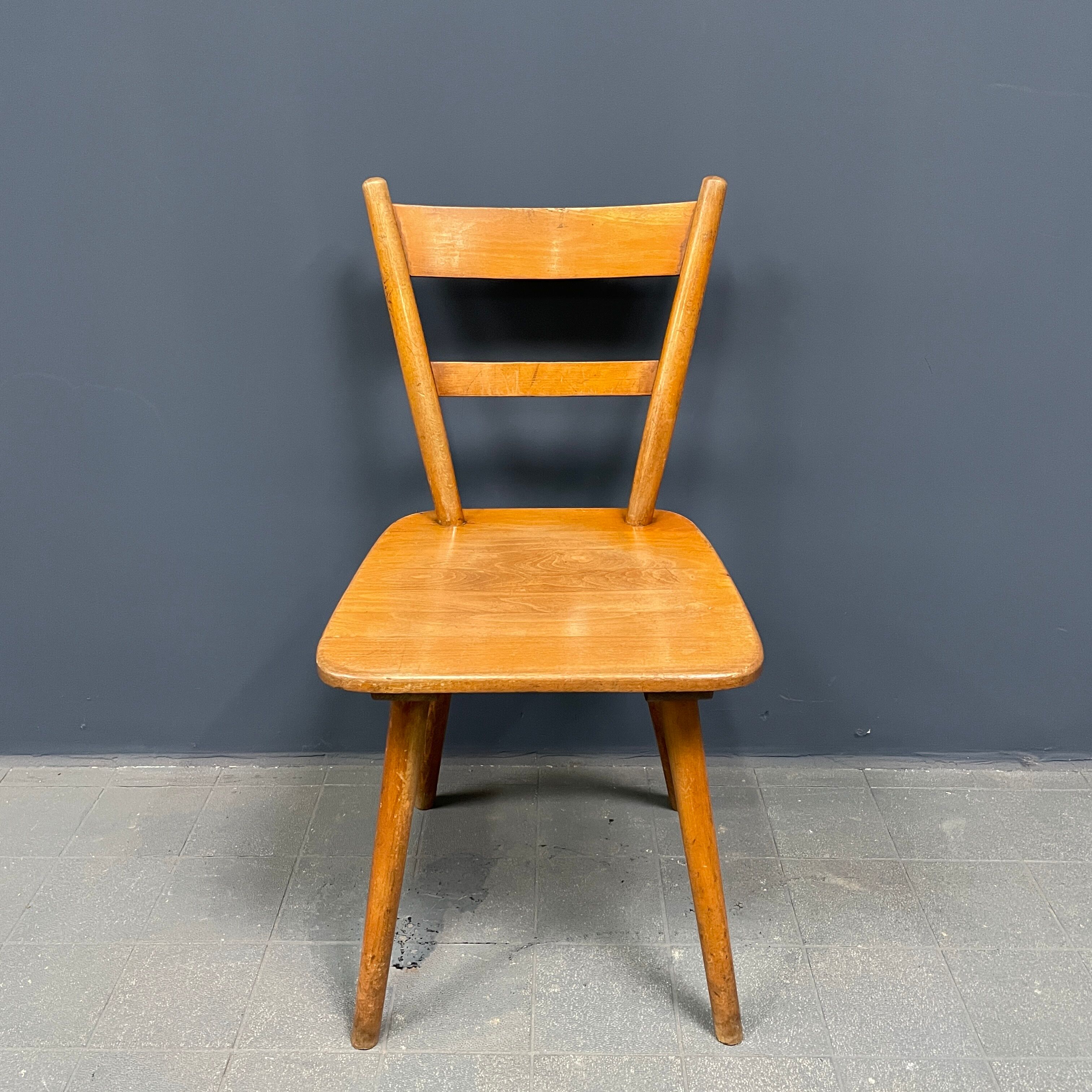 Set of eight german stick chairs from the 1950