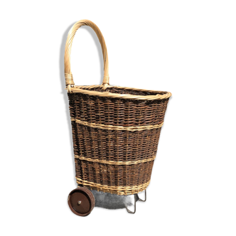Vintage wicker log basket on wheels