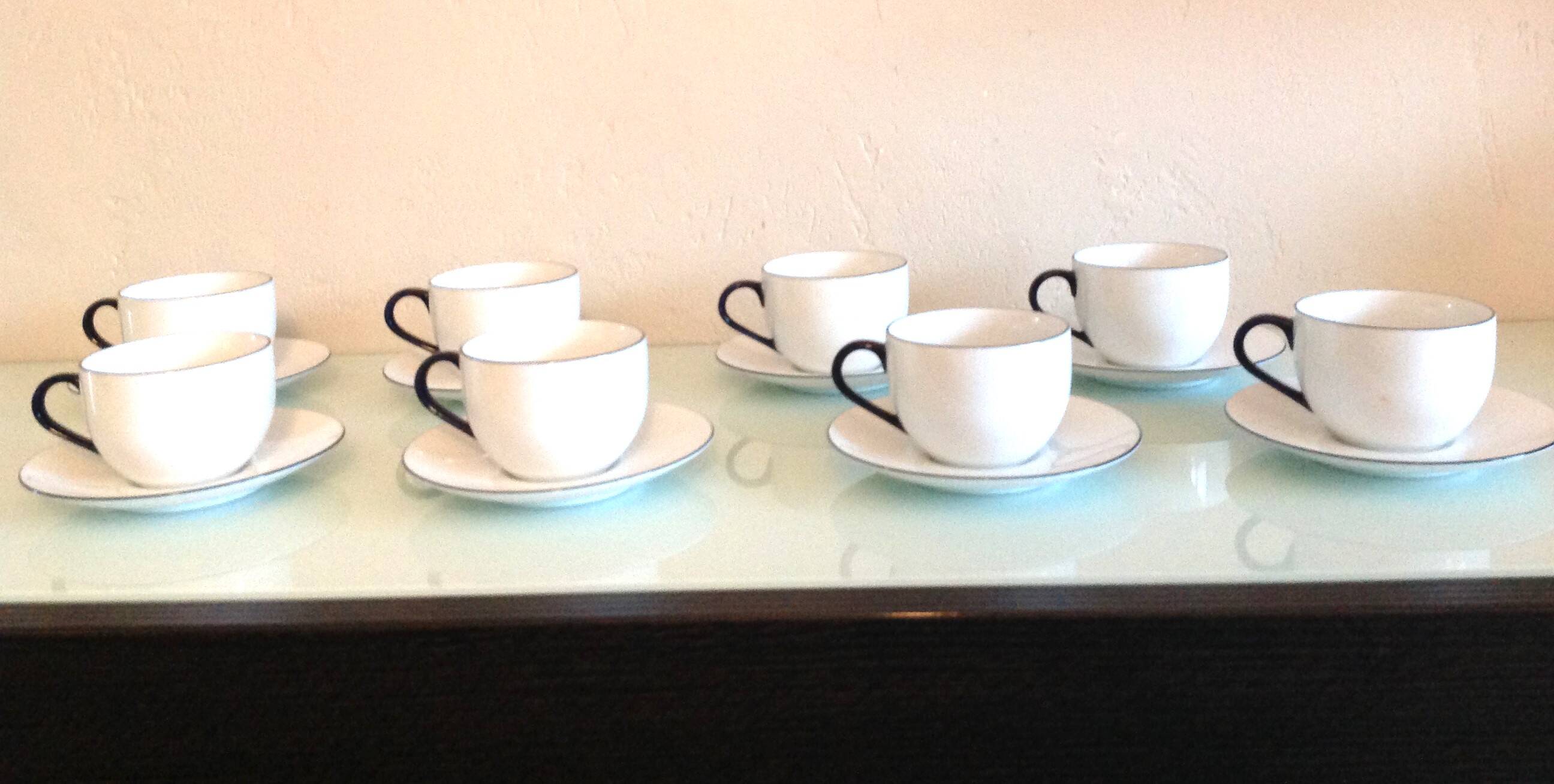 Set of eight white porcelain cups with blue edging / vintage 70s-80s