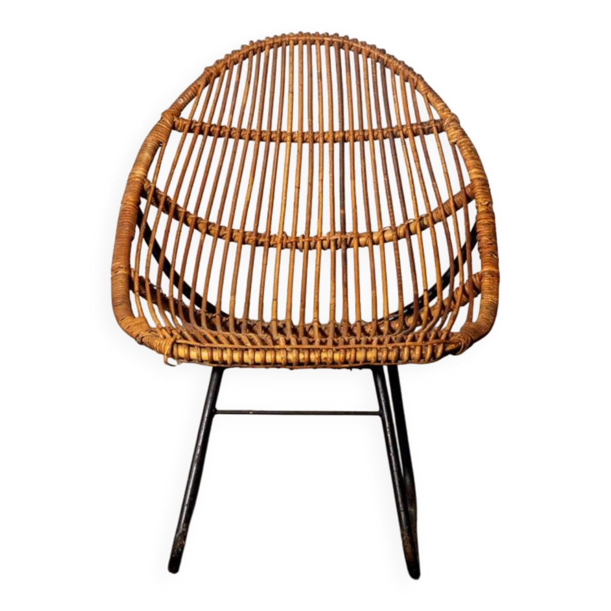 Rattan armchair with metal legs