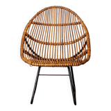 Rattan armchair with metal legs
