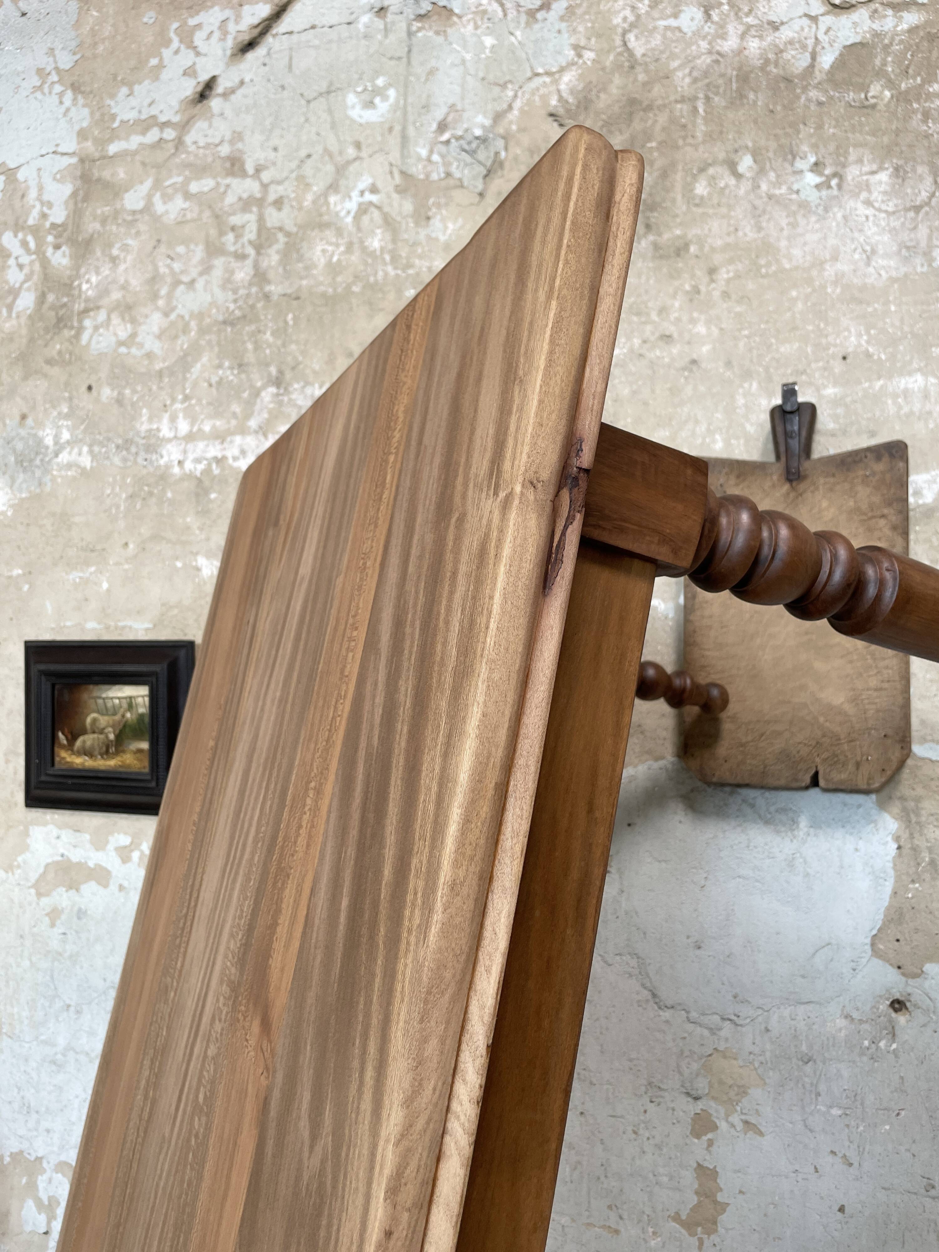 Vintage farmhouse table with turned legs.