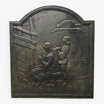 Plaque de cheminée « liseuse devant le feu »