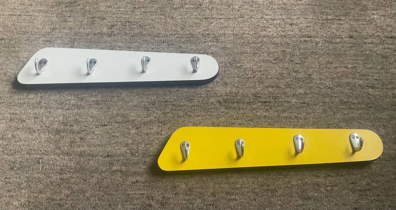 Duo of asymmetrical Formica coat racks from the 60s