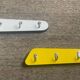 Duo of asymmetrical Formica coat racks from the 60s