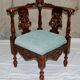 Fauteuil d'angle néo-renaissance en noyer sculpté