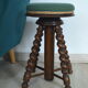 Antique piano stool with adjustable screws and turned wooden legs