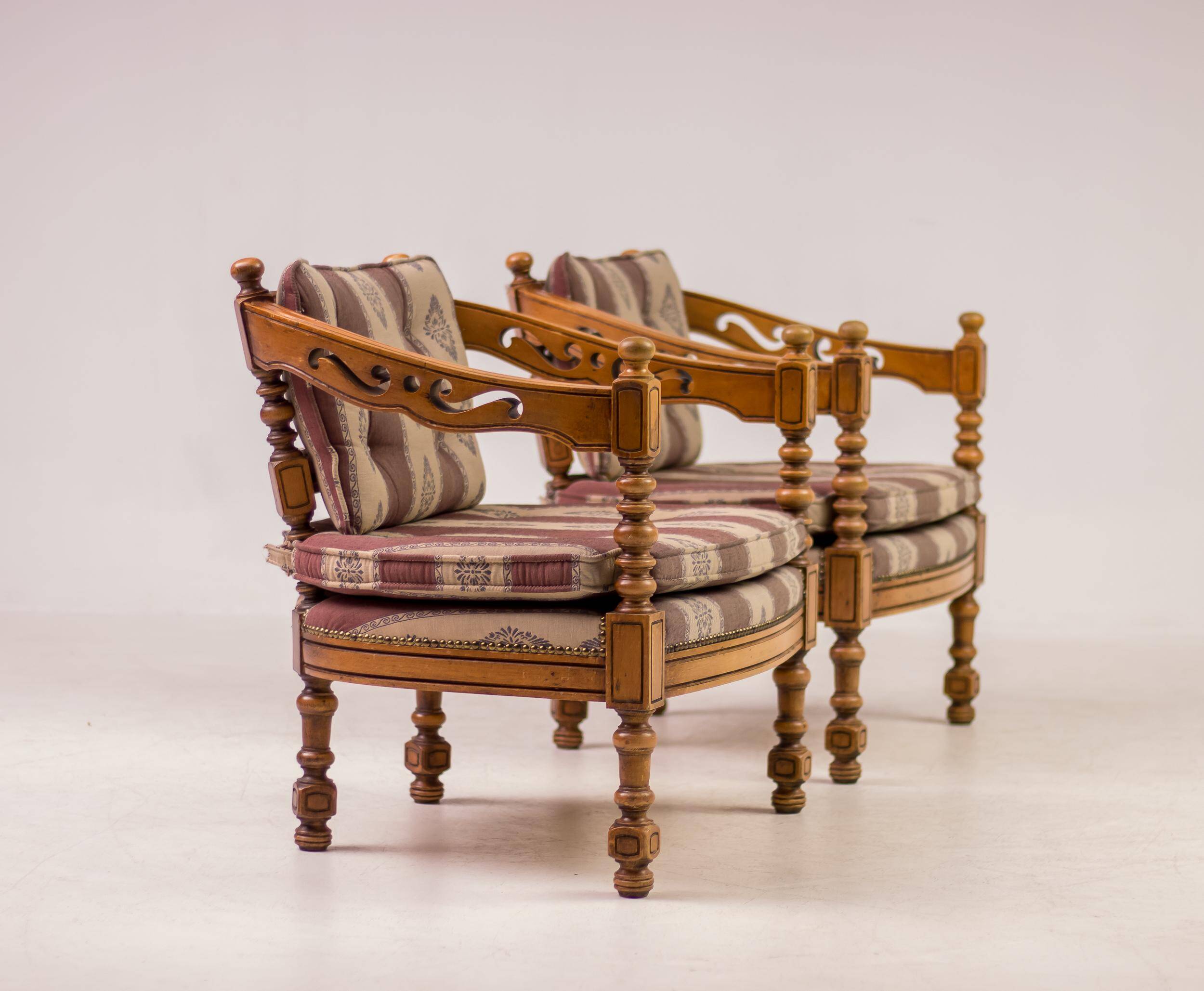 Pair of Giorgetti "1975 Gallery" armchairs in carved wood, original upholstery.