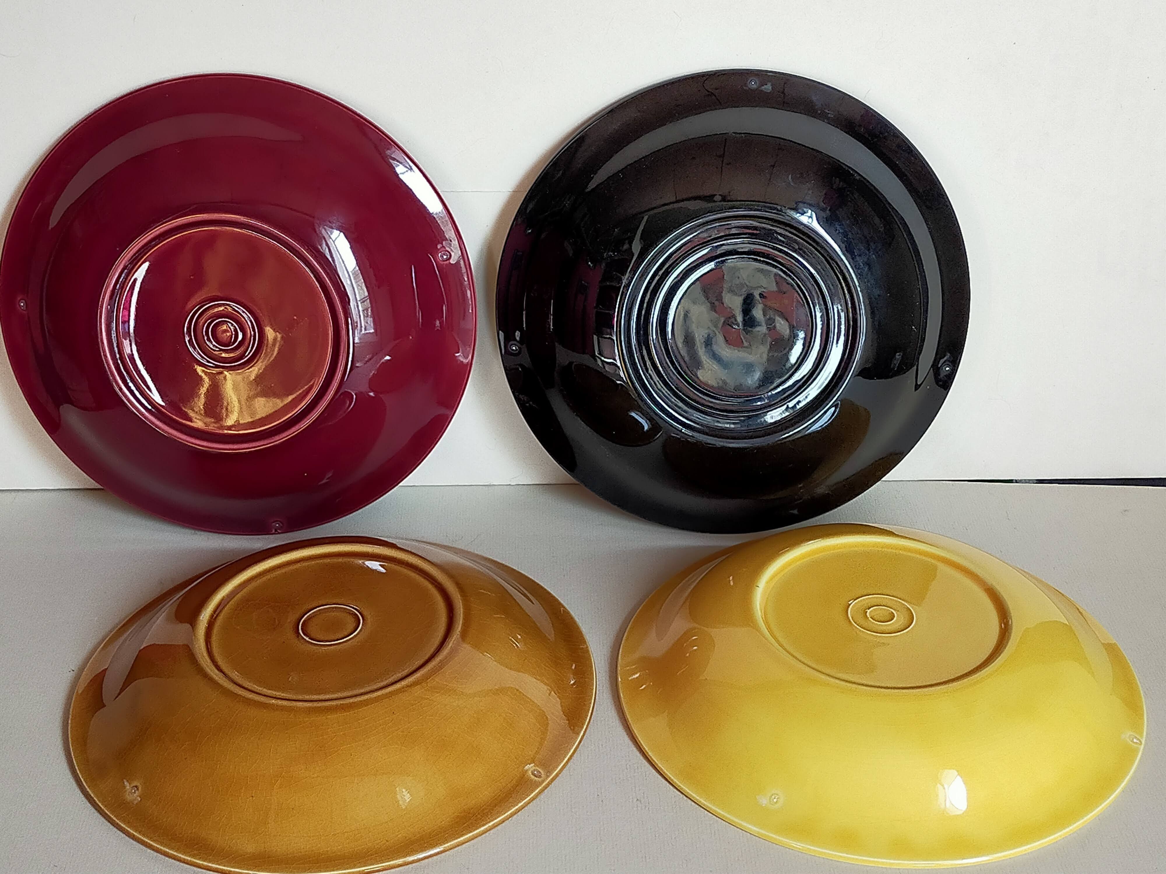 Four multicolored soup plates from the 1950s