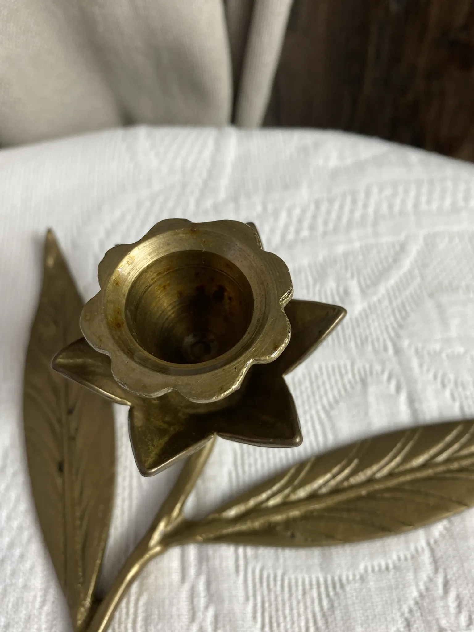 Flower candlestick and removable ashtrays in solid brass.