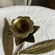 Flower candlestick and removable ashtrays in solid brass.