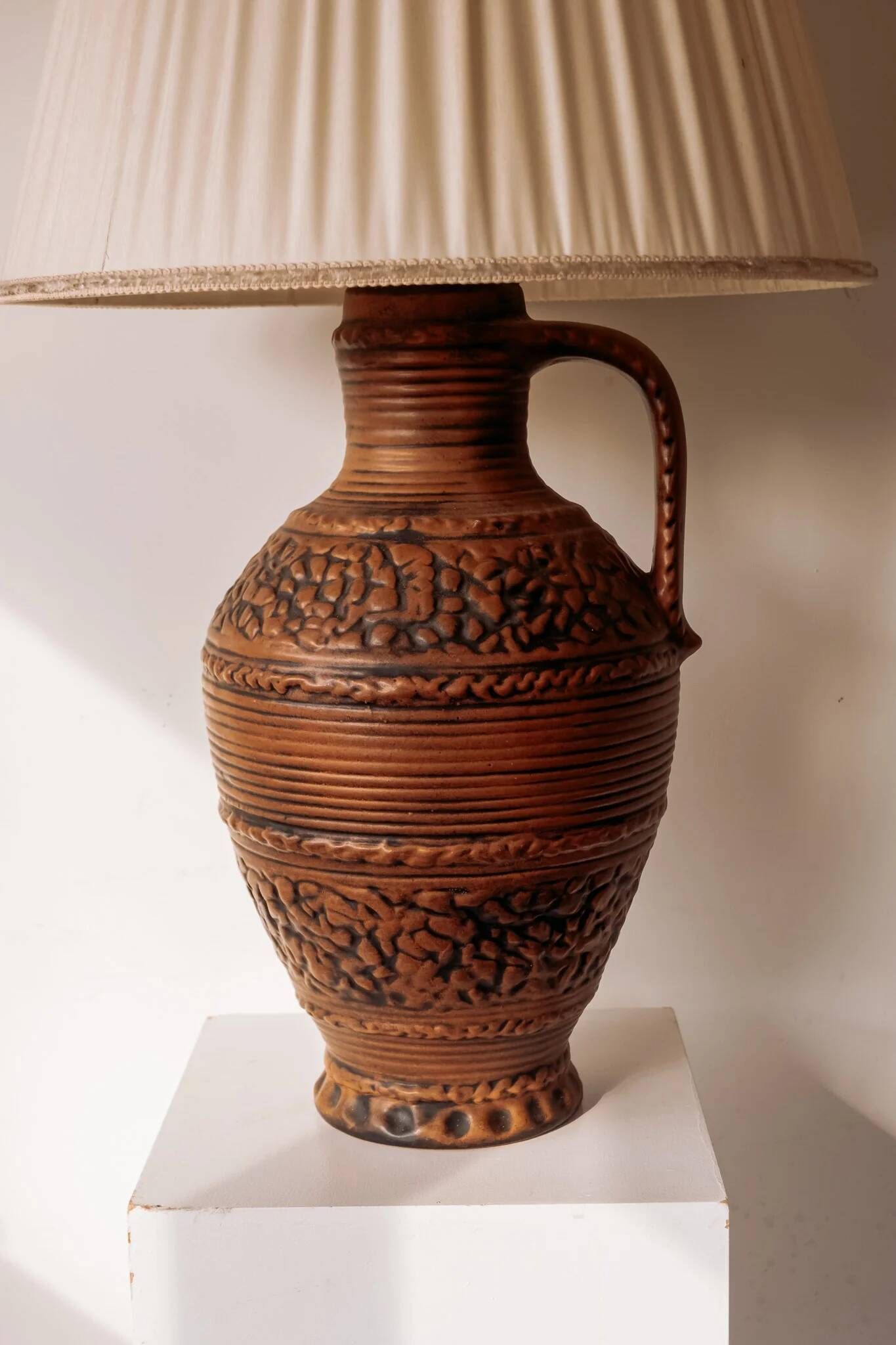 Large ceramic table lamp from West Germany with a pleated shade.