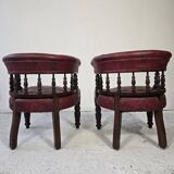 Pair of barrel chairs in turned wood and burgundy leather – Productio