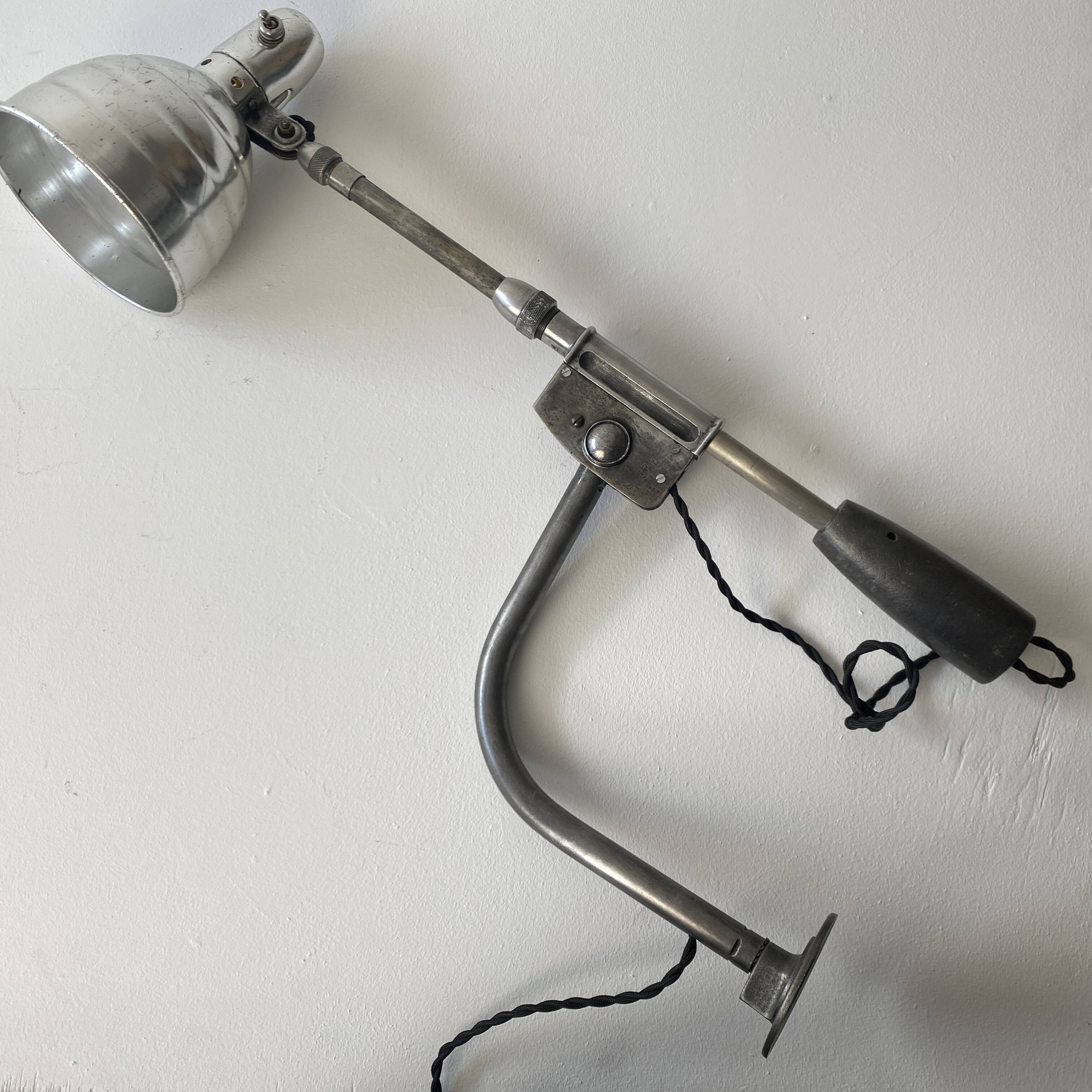 Old industrial wall light with counterweight.