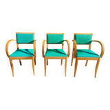 3 vintage bridge chairs with rounded armrests.