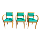3 vintage bridge chairs with rounded armrests.