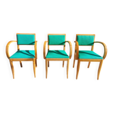 3 vintage bridge chairs with rounded armrests.