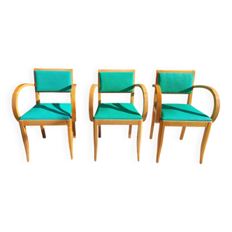3 vintage bridge chairs with rounded armrests.