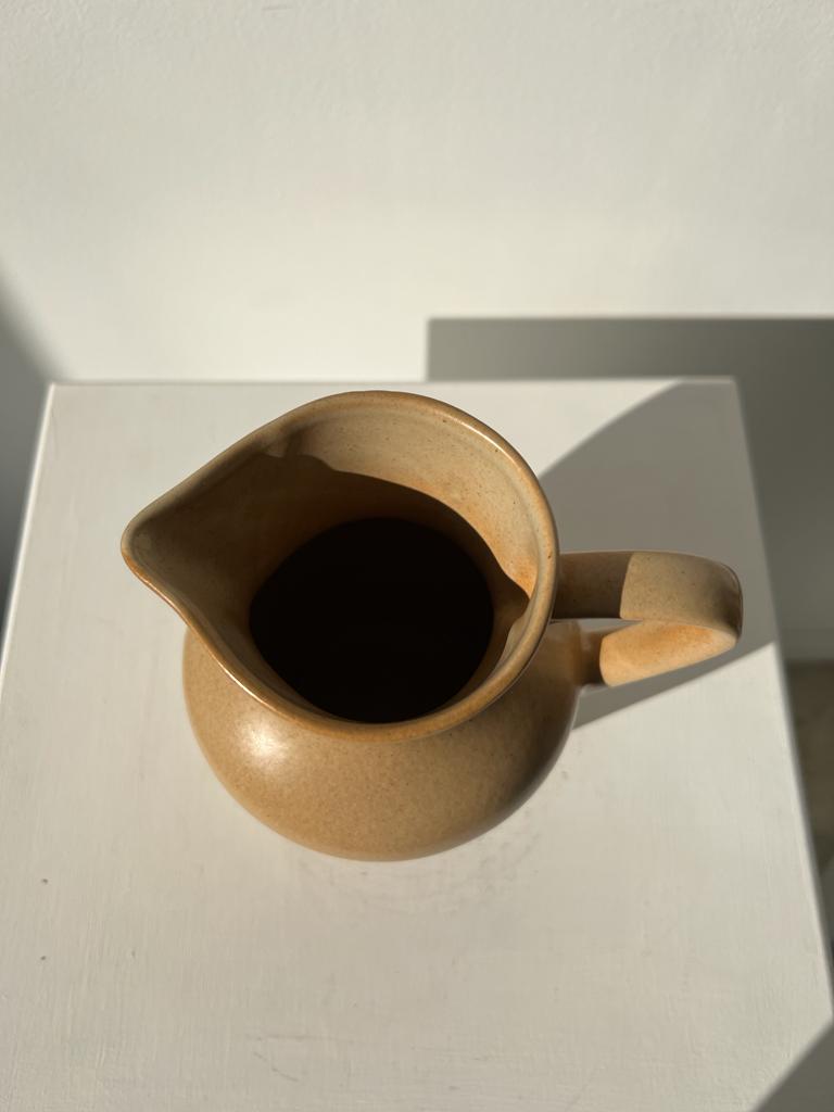 Small pitcher in light beige sandstone