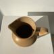 Small pitcher in light beige sandstone