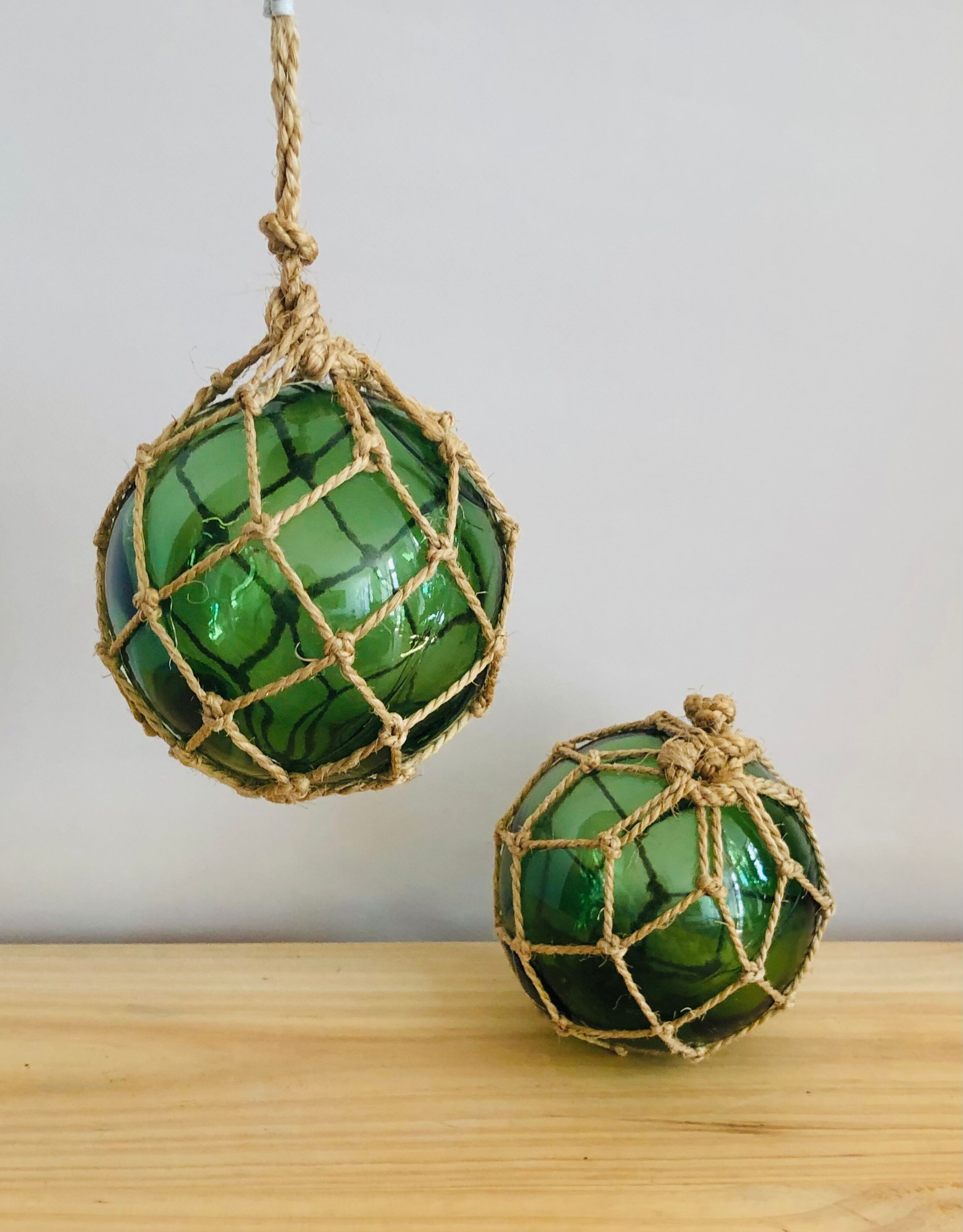 Pair of fishing floats and glass and rope