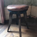 Old leather rotating piano stool