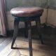 Old leather rotating piano stool