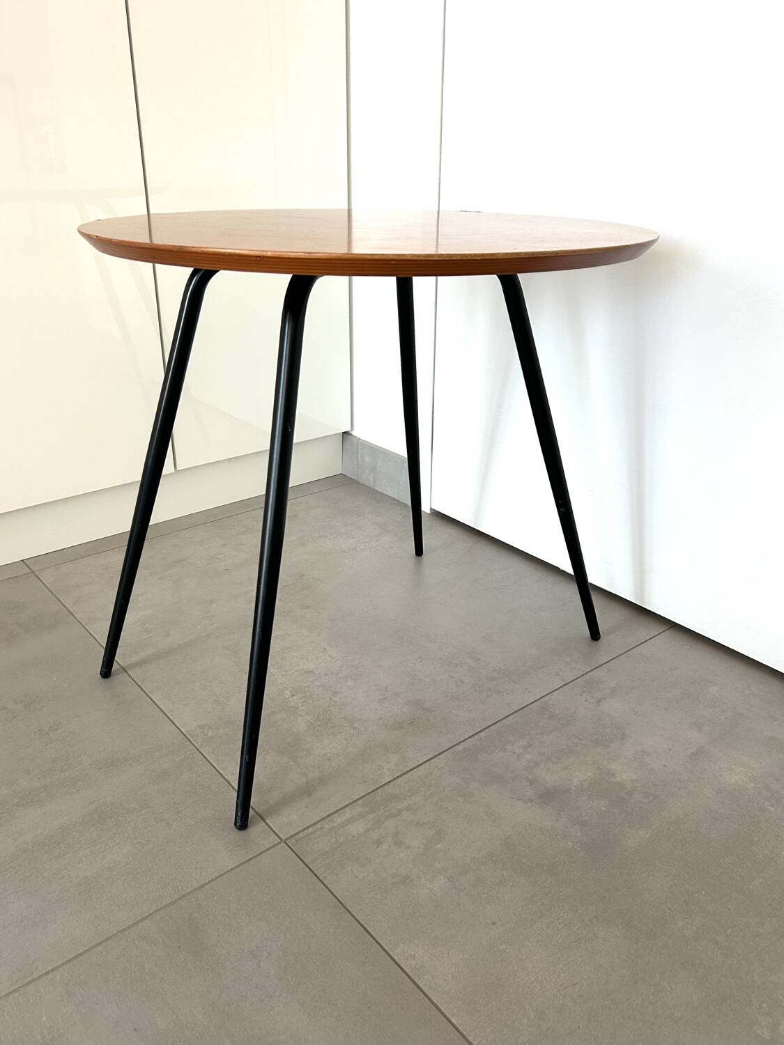 1970s coffee table in honey beech with black steel legs.